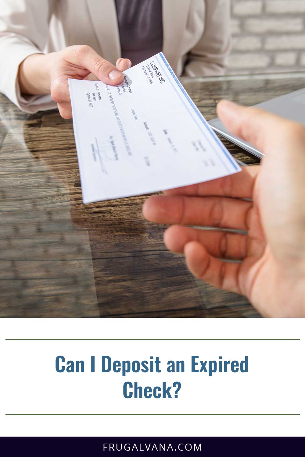 Person in grey suit handing a check to another person - Can I Deposit an Expired Check?